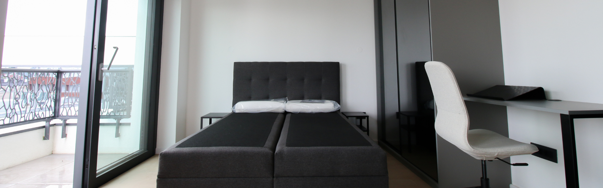The image shows a bedroom in Studio Nova Cesta.