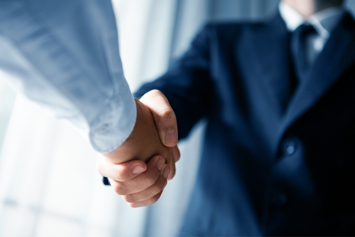 Two men shaking hands.